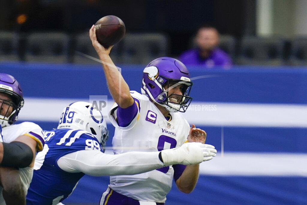 Michael Conroy Minnesota Vikings quarterback Kirk Cousins (8) throws while pressured by Indianapolis Colts' DeForest Buckner (99) during the second half of an NFL football game, Sunday, Sept. 20, 2020, in Indianapolis. (AP Photo/Michael Conroy)