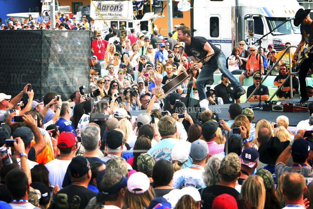 Darryl Graham FILE - Country singer Dierks Bentley performs a concert before the NASCAR Sprint Cub Series auto race in Homestead, Fla., Sunday, Nov. 17, 2013. NASCAR has built itself around its traveling show, every weekend a super-charged event of concerts, camping and infield carousing that closes with a Cup race. The party has been canceled during the pandemic but the playoffs go on, starting Sunday, Sept. 6, 2020, without any of the pomp and circumstance. (AP Photo/J Pat Carter, File)