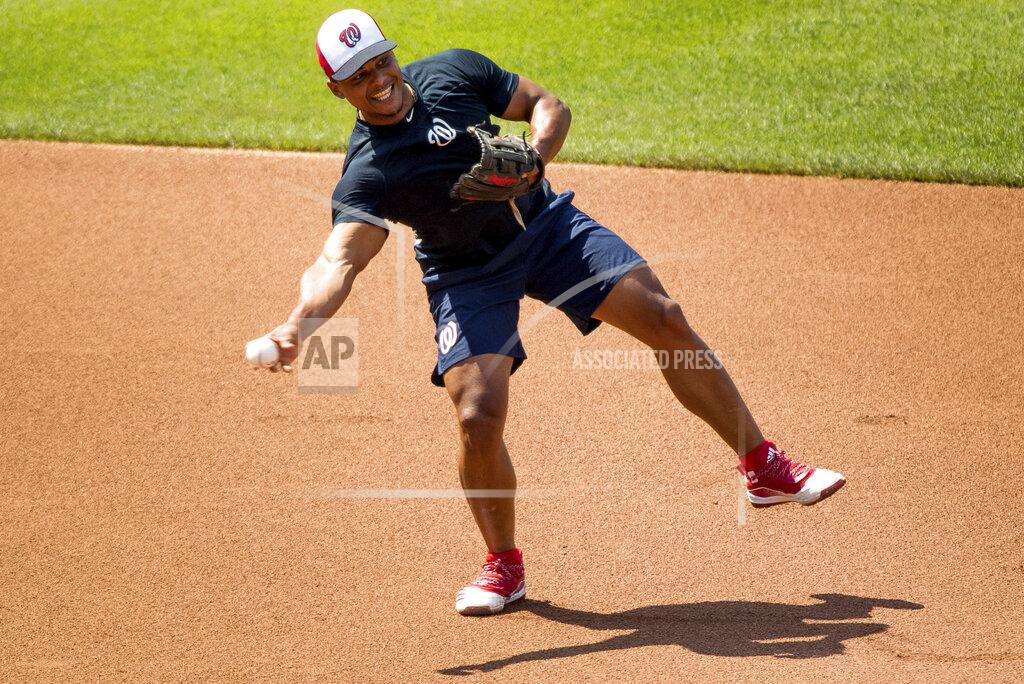 Andrew Harnik Washington Nationals' Wilmer Difo (1) fields a ball as the Washington Nationals hold their first baseball training camp work out at Nationals Stadium, Friday, July 3, 2020, in Washington. (AP Photo/Andrew Harnik)
