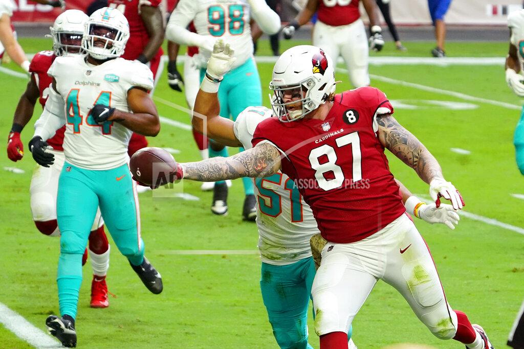 Rick Scuteri Arizona Cardinals tight end Maxx Williams (87) scores a touchdown as Miami Dolphins outside linebacker Kamu Grugier-Hill (51) defends during the first half of an NFL football game, Sunday, Nov. 8, 2020, in Glendale, Ariz. (AP Photo/Rick Scuteri)