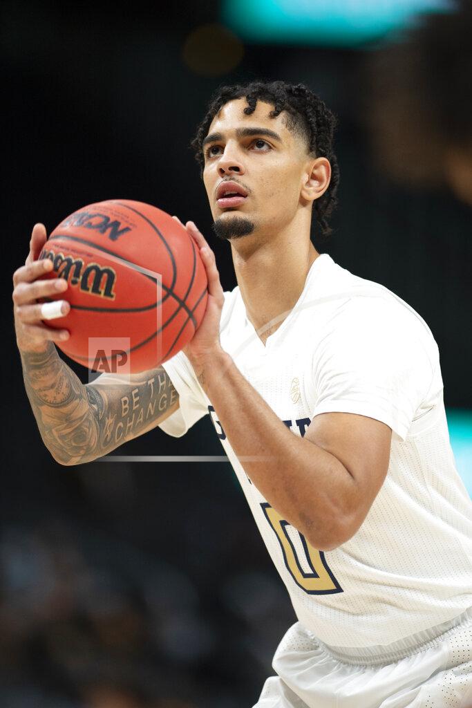 Hakim Wright Sr. Georgia Tech guard Michael Devoe (0) shoots a free throw during the first half of the team's NCAA college basketball game against LSU on Saturday, Dec. 11, 2021, in Atlanta. (AP Photo/Hakim Wright Sr.)