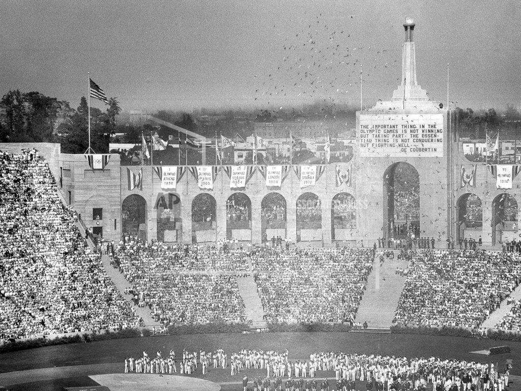Uncredited Doves are released during the opening ceremony for the Tenth Olympiad in Los Angeles on July 30, 1932. The athletes of various countries stand on the field. (AP Photo)