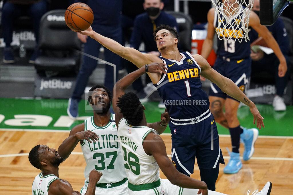 Charles Krupa Denver Nuggets forward Michael Porter Jr. (1) grabs a rebound over the Boston Celtics during the first half of an NBA basketball game, Tuesday, Feb. 16, 2021, in Boston. (AP Photo/Charles Krupa)