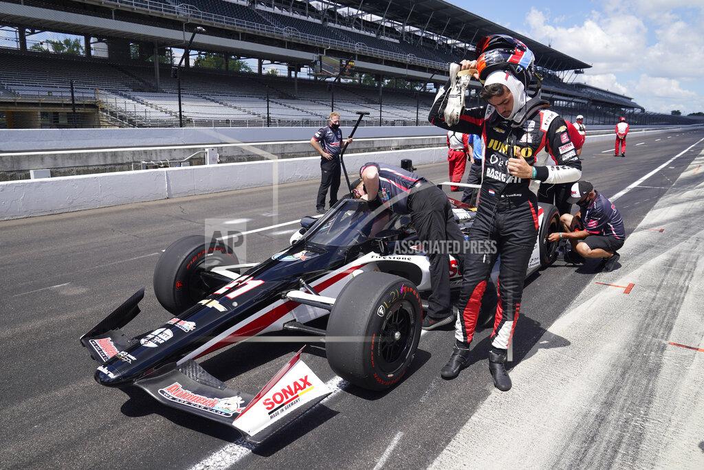 Rinus VeeKay, of the Netherlands, takes off his helmet during qualifications for the Indianapolis 500 auto race at Indianapolis Motor Speedway, Sunday, Aug. 16, 2020, in Indianapolis. (AP Photo/Darron Cummings)