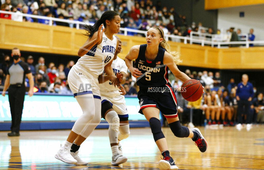 Noah K. Murray Connecticut guard Paige Bueckers (5) drives to the basket against Seton Hall forward Mya Bembry (10) during the first half of an NCAA college basketball game on Friday, Dec. 3, 2021, in South Orange, N.J. (AP Photo/Noah K. Murray)