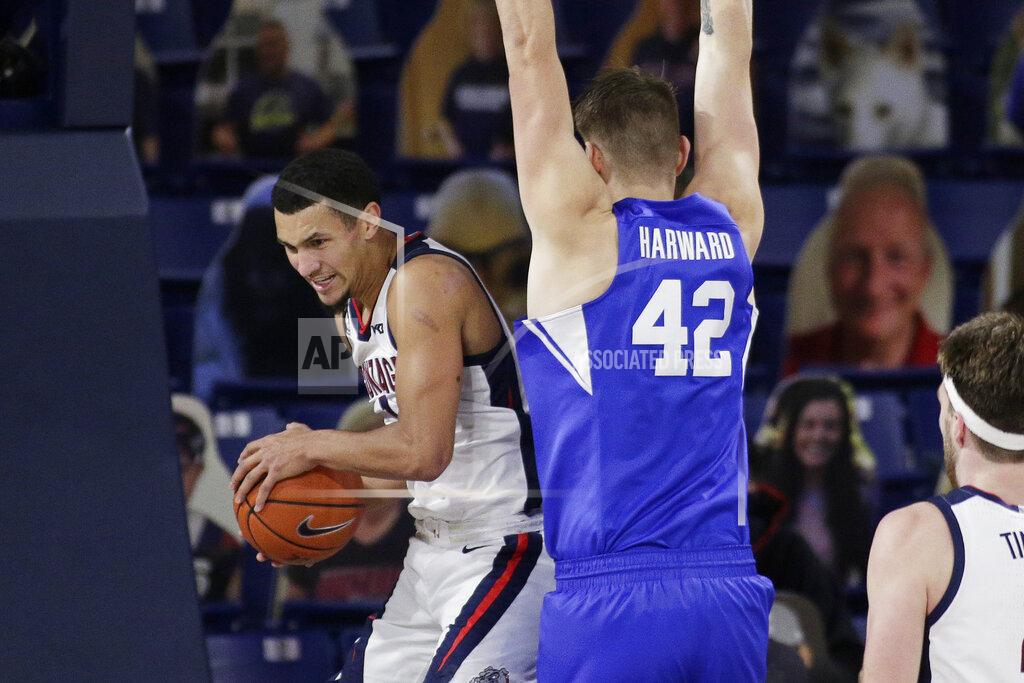 Young Kwak Gonzaga guard Jalen Suggs, left, grabs a rebound next to BYU center Richard Harward during the first half of an NCAA college basketball game in Spokane, Wash., Thursday, Jan. 7, 2021. (AP Photo/Young Kwak)
