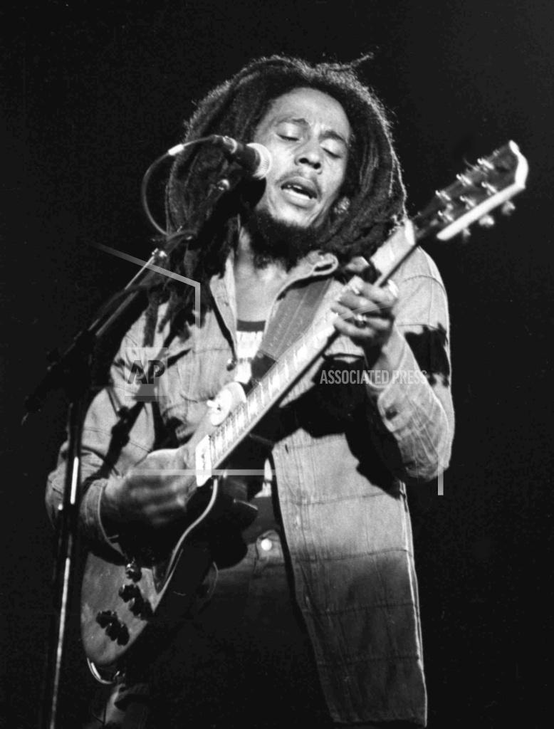 Langevin FILE - In this July 4, 1980 file photo, Jamaican reggae singer Bob Marley performs at a reggae festival concert in Paris. The family of Bob Marley are covering his song “One Love” to raise money for coronavirus relief efforts. (AP Photo/File)