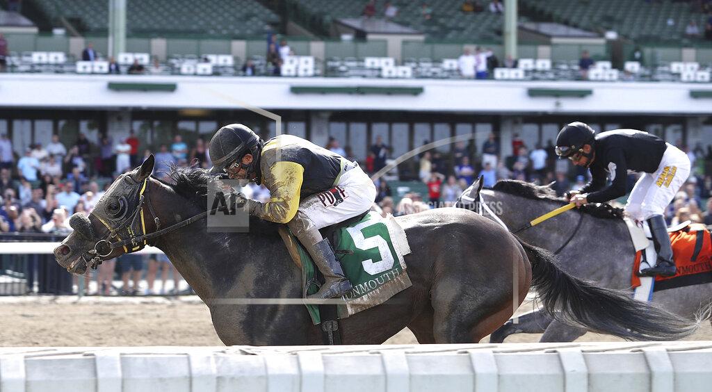 Bill Denver In this photo provided by Equi-Photo, 57-year-old jockey Jose Ferrer rides 79-1 longshot Informative (5) to victory in the Salvator Mile at Monmouth Park Racetrack in Oceanport, N.J., Tuesday, June 12, 2021. At right, is Traffic (7), Paco Lopez up, who finished second. (Bill Denver/Equi-Photo via AP)
