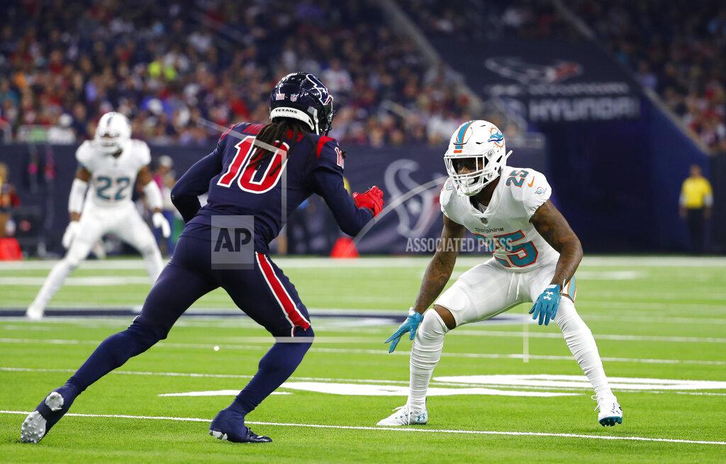 Matt Patterson FILE - In this Oct. 25, 2018, file photo, Miami Dolphins defensive back Xavien Howard (25) looks to defend against Houston Texans' DeAndre Hopkins during an NFL football game in Houston. Howard tied for the NFL lead last year with seven interceptions in only 12 games, made the Pro Bowl for the first time and was rewarded with a $76.5 million, five-year extension, the most lucrative deal ever for a cornerback. (AP Photo/Matt Patterson, File)