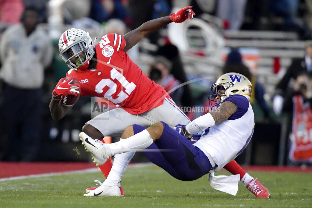 Mark J. Terrill Ohio State wide receiver Parris Campbell is tackled by Washington defensive back Brandon McKinney during the first half of the Rose Bowl NCAA college football game Tuesday, Jan. 1, 2019, in Pasadena, Calif. (AP Photo/Mark J. Terrill)