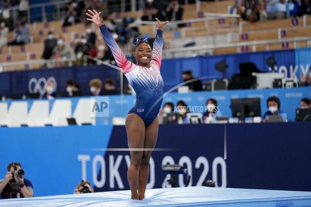 Ashley Landis Simone Biles, of the United States, finishes on the balance beam during the artistic gymnastics women's apparatus final at the 2020 Summer Olympics, Tuesday, Aug. 3, 2021, in Tokyo, Japan. (AP Photo/Ashley Landis)