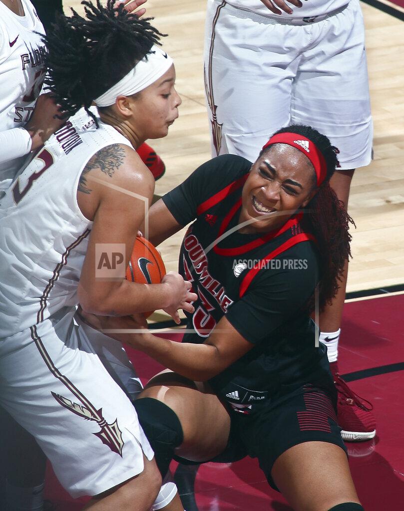 Phil Sears Florida State guard Nausia Woolfolk (13) and Louisville forward Bionca Dunham (33) fight for control of the ball during the first half of an NCAA college basketball game in Tallahassee, Fla., Thursday, Jan. 24, 2019. (AP Photo/Phil Sears)