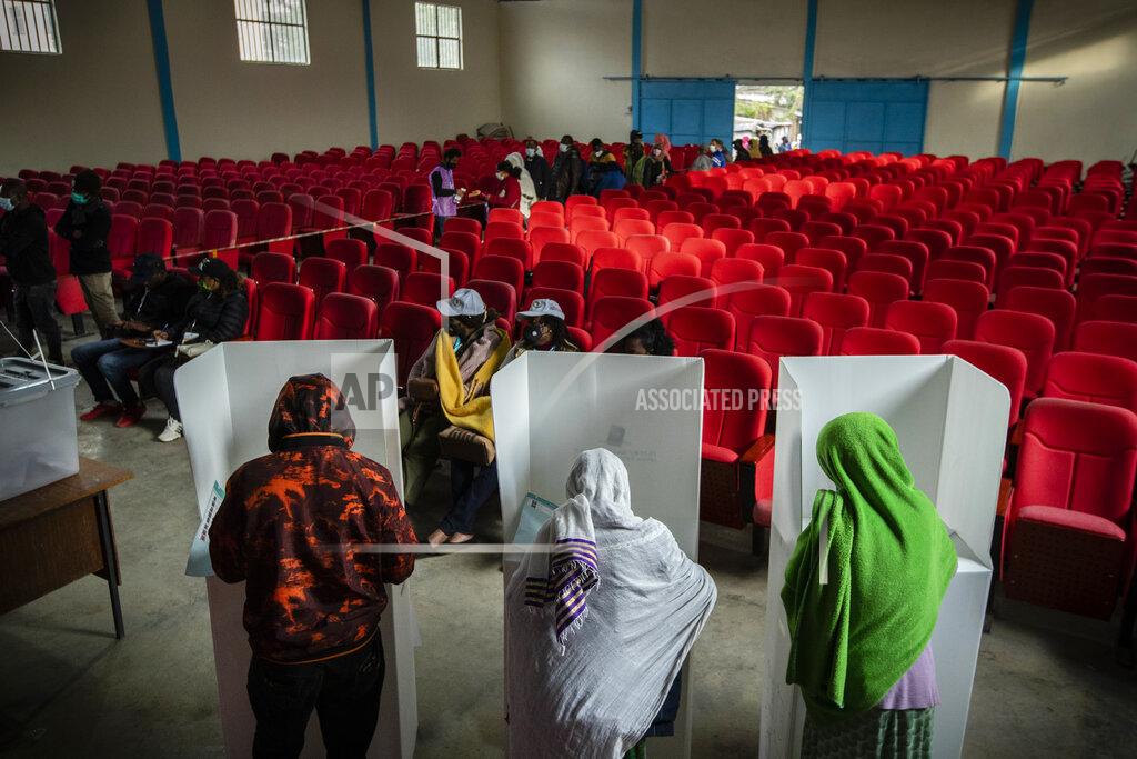 Ben Curtis Ethiopians cast their votes in the general election at a polling center in the capital Addis Ababa, Ethiopia, Monday, June 21, 2021. Ethiopia was voting Monday in the greatest electoral test yet for Prime Minister Abiy Ahmed as insecurity and logistical issues meant ballots wouldn't be cast in more than 100 constituencies of the 547 across the country. (AP Photo/Ben Curtis)
