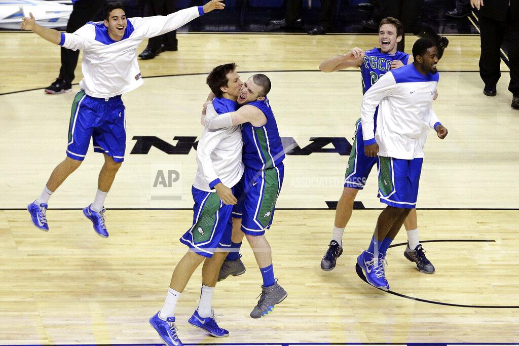 Matt Slocum FILE - In this March 22, 2013, file photo, Florida Gulf Coast players celebrate after winning a second-round game against Georgetown, 78-68, in the NCAA college basketball tournament in Philadelphia. They remain the biggest party crashers in tournament history, not just because of their seeding but also because they were in only their second season of full Division I eligibility.(AP Photo/Matt Slocum, File)