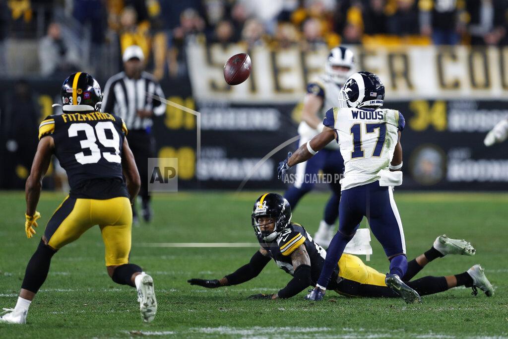 Pittsburgh Steelers free safety Minkah Fitzpatrick (39) prepares to intercept a pass intended for Los Angeles Rams wide receiver Robert Woods (17) during the second half of an NFL football game in Pittsburgh, Sunday, Nov. 10, 2019. (AP Photo/Keith Srakocic)