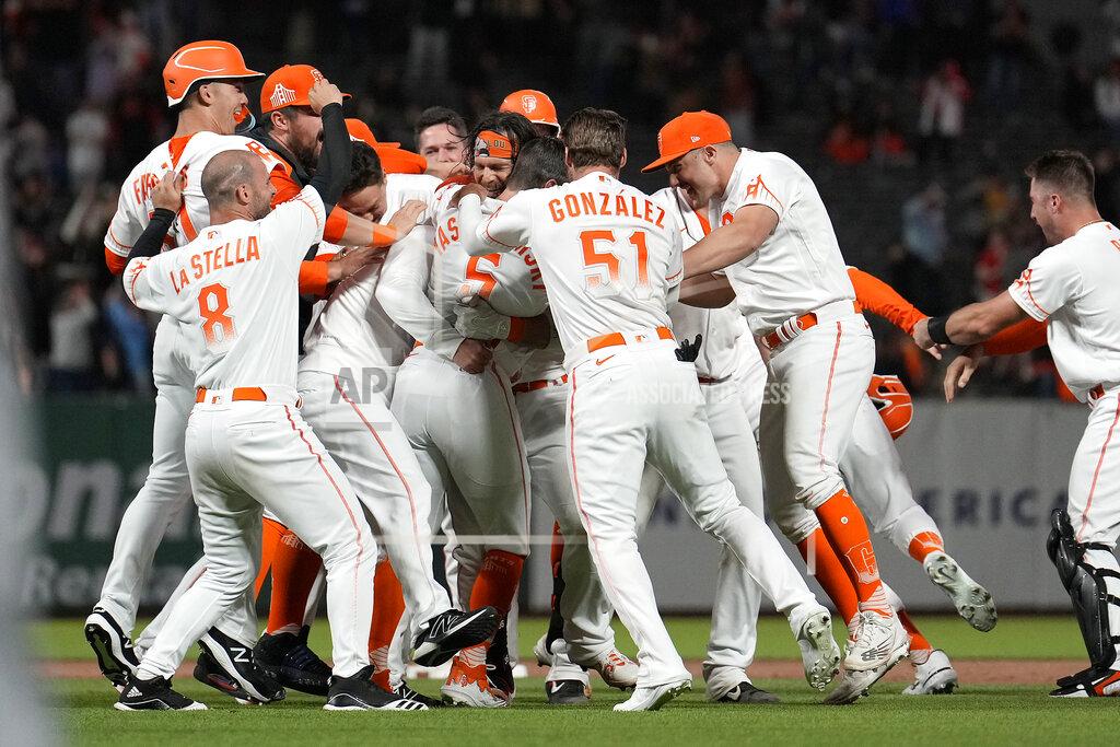 Tony Avelar San Francisco Giants' Brandon Crawford celebrates with teammates after hitting a single to drive in the winning run against the New York Mets during the ninth inning of a baseball game in San Francisco, Tuesday, May 24, 2022. The Giants win 13-12. (AP Photo/Tony Avelar)