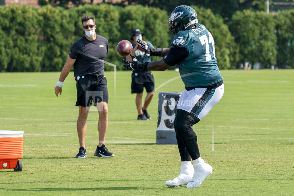 Philadelphia Eagles tackle Jason Peters catches the ball from executive Connor Barwin during an NFL football practice, Thursday, Aug. 27, 2020, in Philadelphia. (AP Photo/Chris Szagola, Pool)