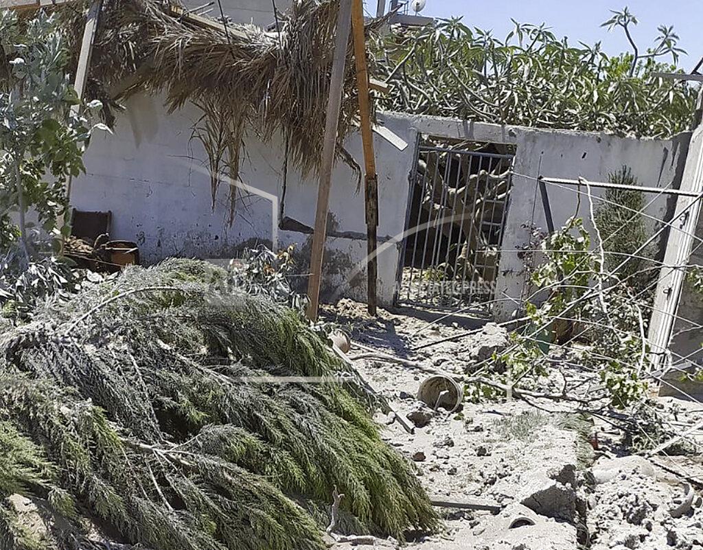 Uncredited Debris from an Israeli airstrike scatters the family farm of Associated Press journalist Fares Akram on Friday, May 14, 2021, in the northern Gaza Strip. (Fares Akram via AP)