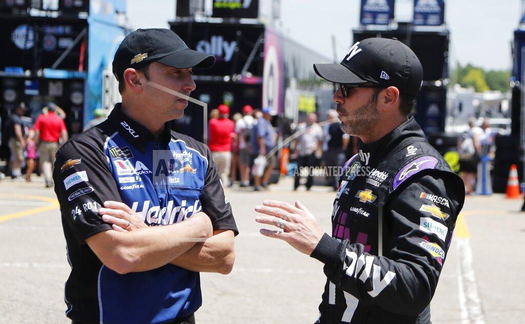 Carlos Osorio Crew chief Chad Knaus, left, talks with former teammate Jimmie Johnson before practice for a NASCAR cup series auto race at Michigan International Speedway, Friday, June 7, 2019, in Brooklyn, Mich. (AP Photo/Carlos Osorio)