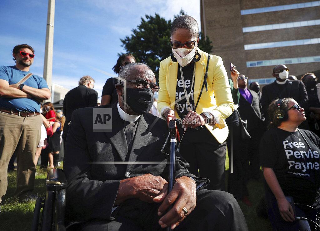 Patrick Lantrip Rolanda Holman attends to her father, Pastor Carl Payne, during a vigil for Pervis Payne outside of the Shelby County Criminal Justice Center on Friday, June 4, 2021 in Memphis. A hearing is scheduled Friday in the case of Payne, a Tennessee death row inmate who has long maintained his innocence and whose lawyers filed a petition saying he is intellectually disabled and should not be executed. (Patrick Lantrip/Daily Memphian via AP)