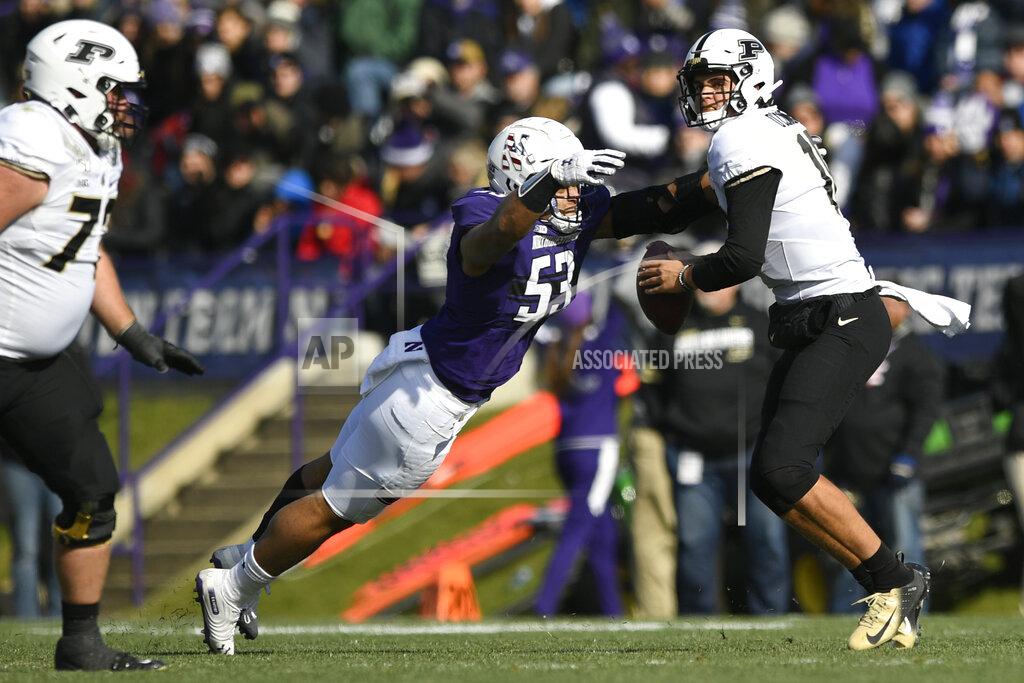 Paul Beaty Northwestern defensive end Eku Leota (53) strips the ball away from Purdue quarterback Aidan O'Connell (16) causing a fumble during the first half of an NCAA college football game, Saturday, Nov. 9, 2019, in Evanston, Ill. (AP Photo/Paul Beaty)