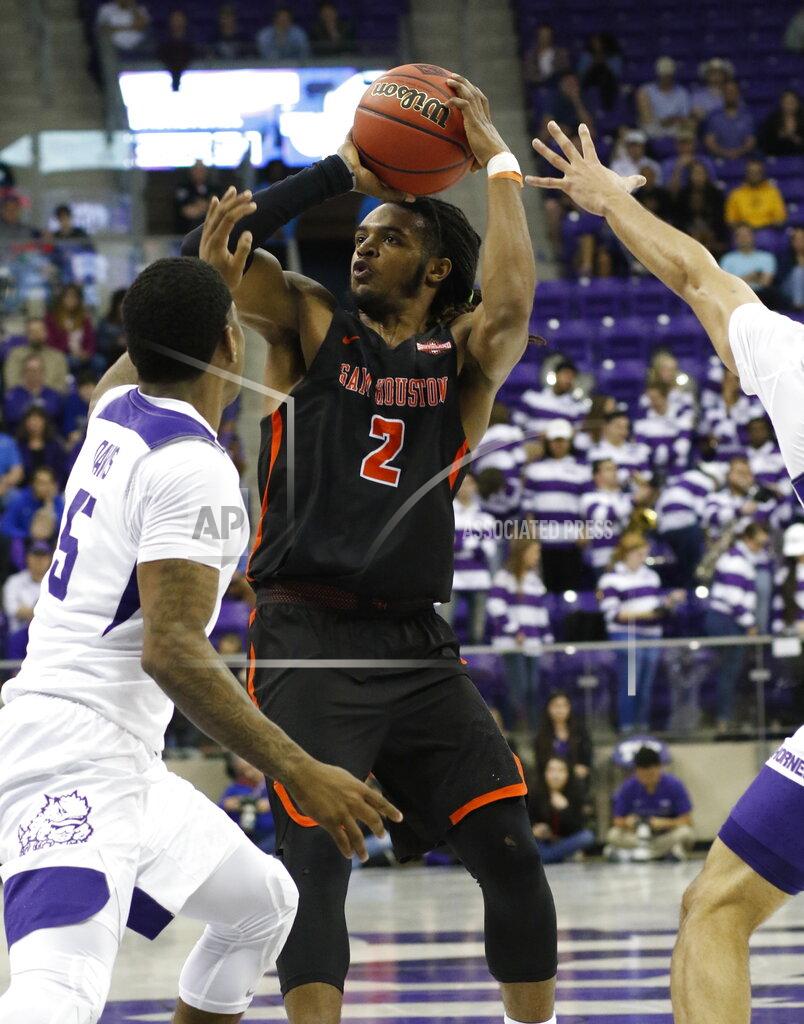 David Kent TCU guard Kendric Davis (5) defends against Sam Houston State guard Cameron Delaney (2) during the first half of an NCAA college basketball game in the NIT on Wednesday, March 20, 2019, in Fort Worth, Texas. (David Kent/Star-Telegram via AP)