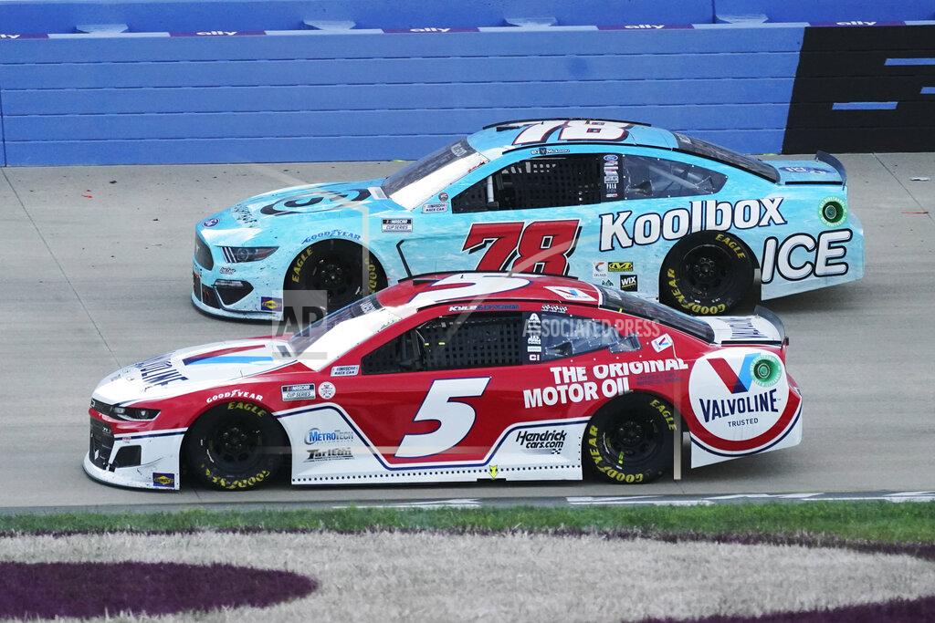 Mark Humphrey Winning driver Kyle Larson (5) passes BJ McLeod (78) in the final laps at Nashville Superspeedway during a NASCAR Cup Series auto race Sunday, June 20, 2021, in Lebanon, Tenn. (AP Photo/Mark Humphrey)
