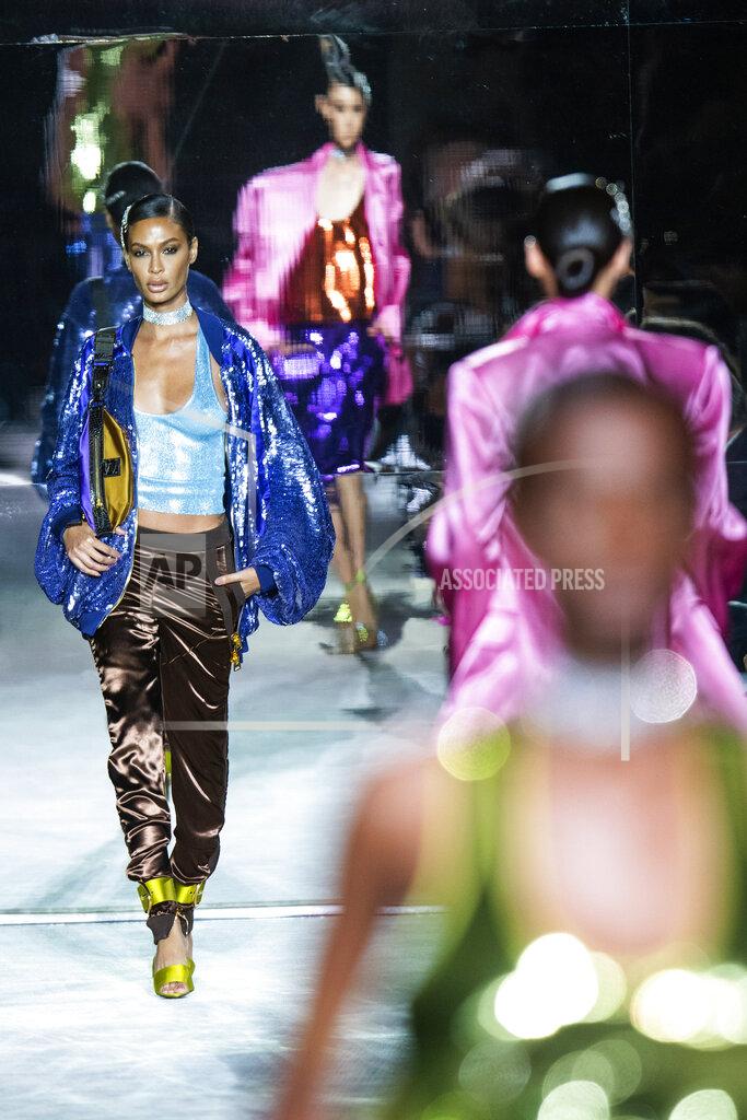 Eduardo Munoz Alvarez Models walk the runway at the Tom Ford spring/summer 2022 fashion show at Lincoln Center during New York Fashion Week on Sunday, Sept. 12, 2021. (AP Photo/Eduardo Munoz Alvarez)