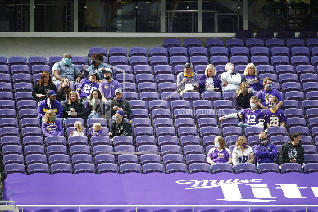 Bruce Kluckhohn Fans watch from the stands during the first half of an NFL football game between the Minnesota Vikings and the Tennessee Titans, Sunday, Sept. 27, 2020, in Minneapolis. (AP Photo/Bruce Kluckhohn)