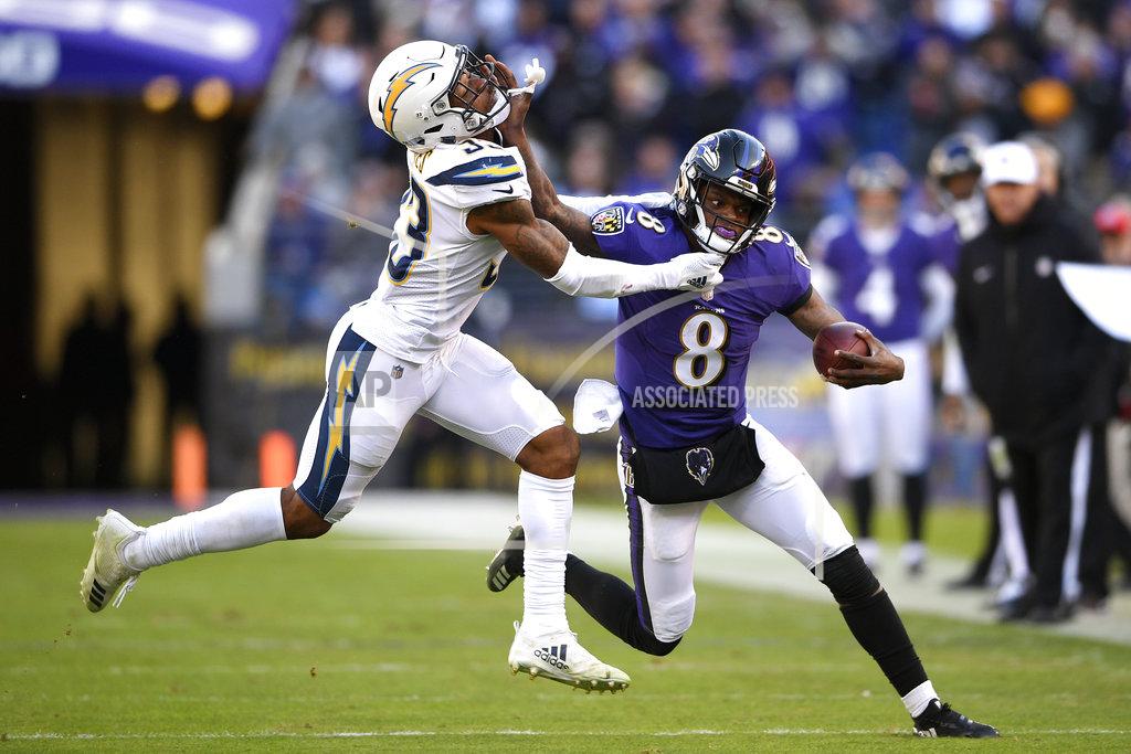 Nick Wass Baltimore Ravens quarterback Lamar Jackson, right, rushes against Los Angeles Chargers free safety Derwin James in the second half of an NFL wild card playoff football game, Sunday, Jan. 6, 2019, in Baltimore. (AP Photo/Nick Wass)