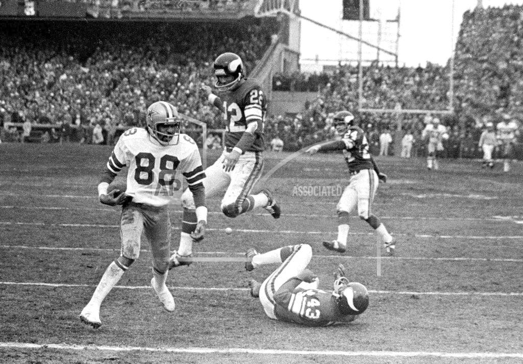 Uncredited FILE - In this Dec. 28, 1975, file photo, Dallas Cowboy wide receiver Drew Pearson (88) nears the end zone on a game-winning 50-yard touchdown pass play in the fourth quarter of an NFL football game against the Minnesota Vikings in Bloomington, Minn. Cowboys quarterback Roger Staubach explained his game-winning throw by saying, "I closed my eyes and said a Hail Mary. (AP Photo/File)