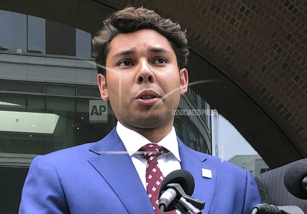 Philip Marcelo FILE — In this Sept. 6, 2019 file photo, Fall River Mayor Jasiel Correia speaks to reporters outside the federal courthouse in Boston, following his appearance on bribery, extortion and fraud charges. Correia heads to trial in federal court in April 2021 on charges that he stole more than $230,000 from investors in a smartphone app he created to pay for things like a Mercedes, casino trips and adult entertainment. As mayor, he's accused of convincing his chief of staff to give him half of her salary in order to keep her city job and extorting hundreds of thousands of dollars from marijuana businesses seeking to operate there.(AP Photo/Philip Marcelo, File)