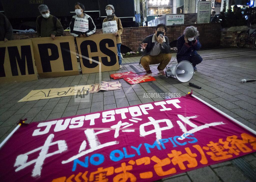 Hiro Komae FILE - In this March 25, 2021, file photo, a "No Olympics" banner is placed by protesters in Tokyo during a demonstration against the going ahead of the Tokyo 2020 Olympic and Paralympic Games. Some nurses in Japan are incensed at a request from Tokyo Olympic organizers to have 500 of them dispatched to help out with the games. They say they’re already near the breaking point dealing with the coronavirus pandemic. A protest message saying that nurses were opposed to holding the Olympic went viral on Japanese Twitter recently, being retweeted hundreds of thousands of times. (AP Photo/Hiro Komae, File)