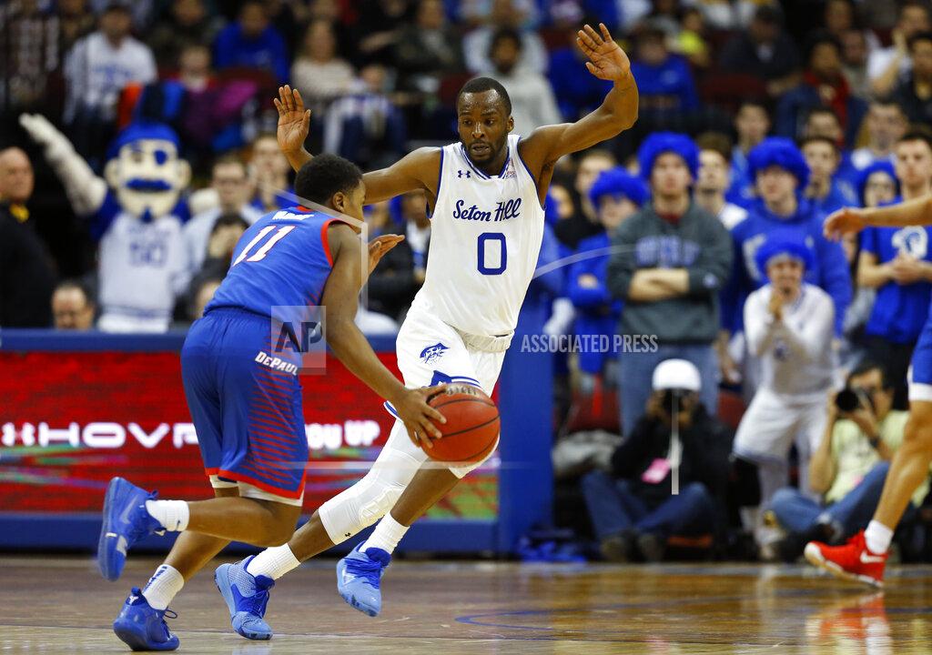 Noah K. Murray Seton Hall's Quincy McKnight (0) defends against DePaul's Charlie Moore (11) during the second half of an NCAA college basketball game Wednesday, Jan. 29, 2020, in Newark, N.J. (AP Photo/Noah K. Murray)