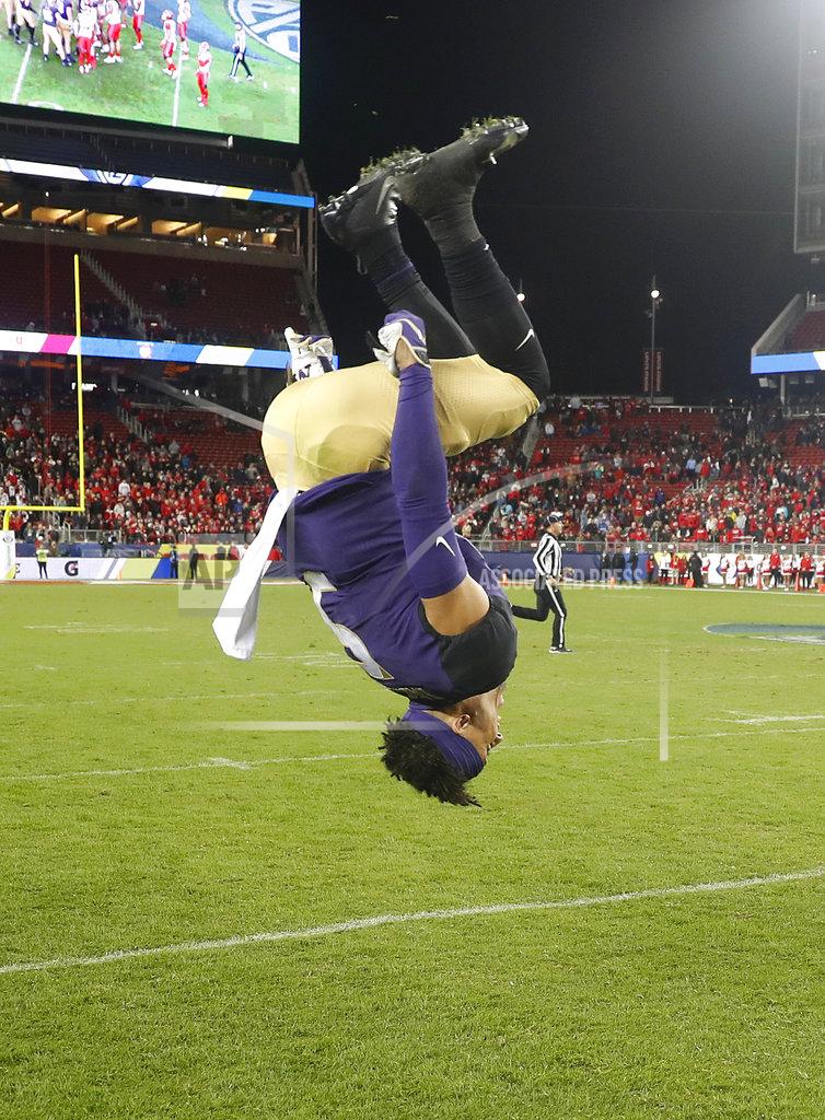 Tony Avelar Washington wide receiver Andre Baccellia does a backflip after Washington defeated Utah 10-3 in the Pac-12 Conference championship NCAA college football game in Santa Clara, Calif., Friday, Nov. 30, 2018. (AP Photo/Tony Avelar)