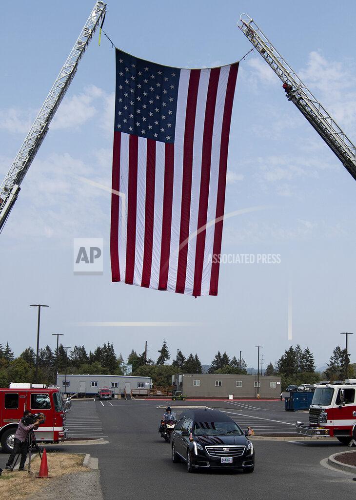 Joshua Hart Washington State Patrol officers escort a hearse carrying the casket of Clark County Sheriff's Detective Jeremy Brown following his funeral service Tuesday, Aug. 3, 2021, at ilani Casino, in La Center, Wash. Brown was fatally shot July 23 while on duty. (Joshua Hart/The Columbian via AP)