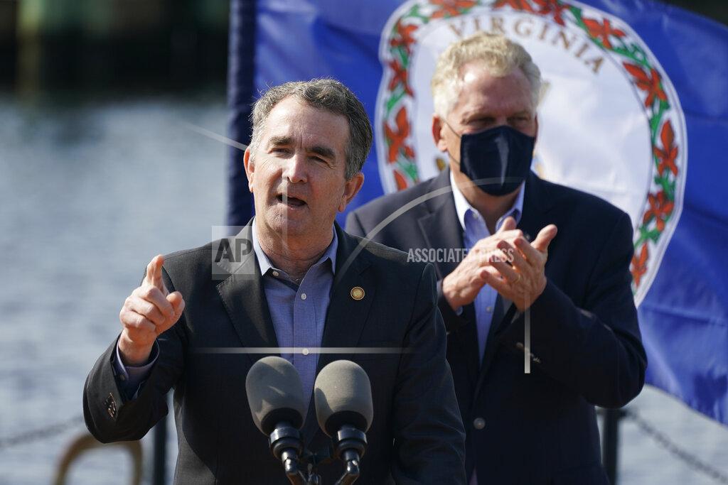 Steve Helber Virginia Gov. Ralph Northam, left, gestures as he speaks during a news conference along with former Gov. and Democratic gubernatorial candidate, Terry McAuliffe, right, at Waterside in Norfolk, Va., Thursday, April 8, 2021. Northam endorsed McAuliffe for governor. (AP Photo/Steve Helber)