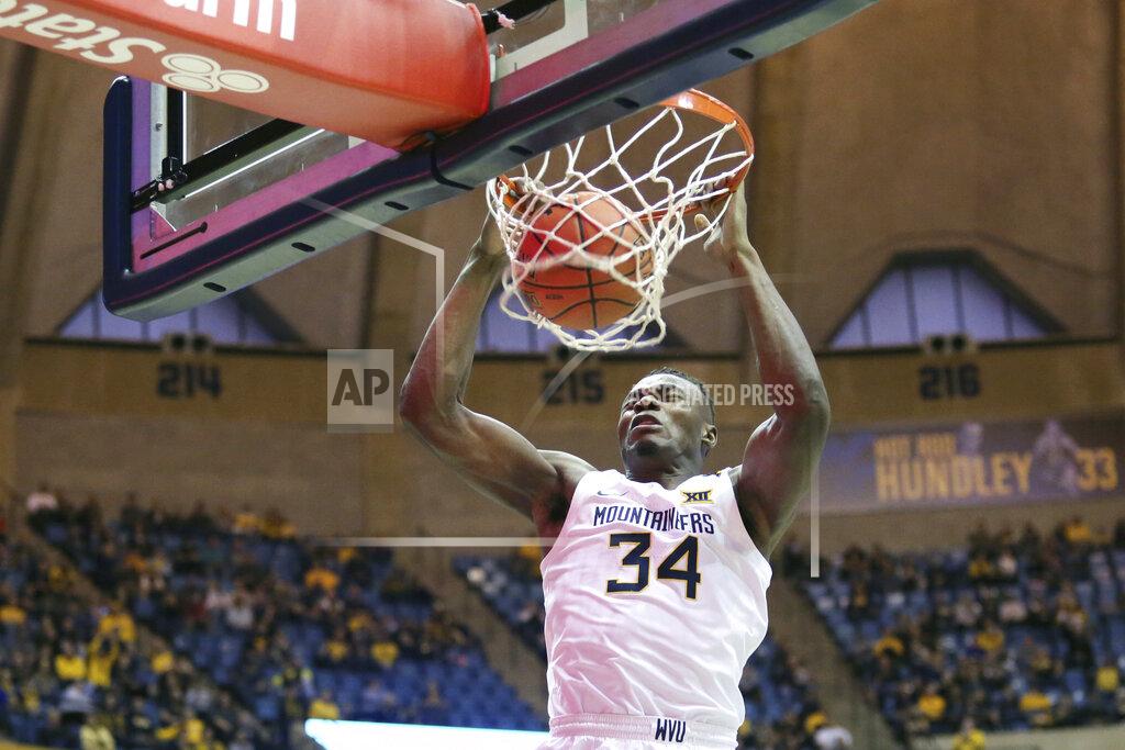 Kathleen Batten West Virginia forward Oscar Tshiebwe (34) dunks the ball against Nicholls State during the second half of an NCAA college basketball game Saturday, Dec. 14, 2019, in Morgantown, W.Va. (AP Photo/Kathleen Batten)