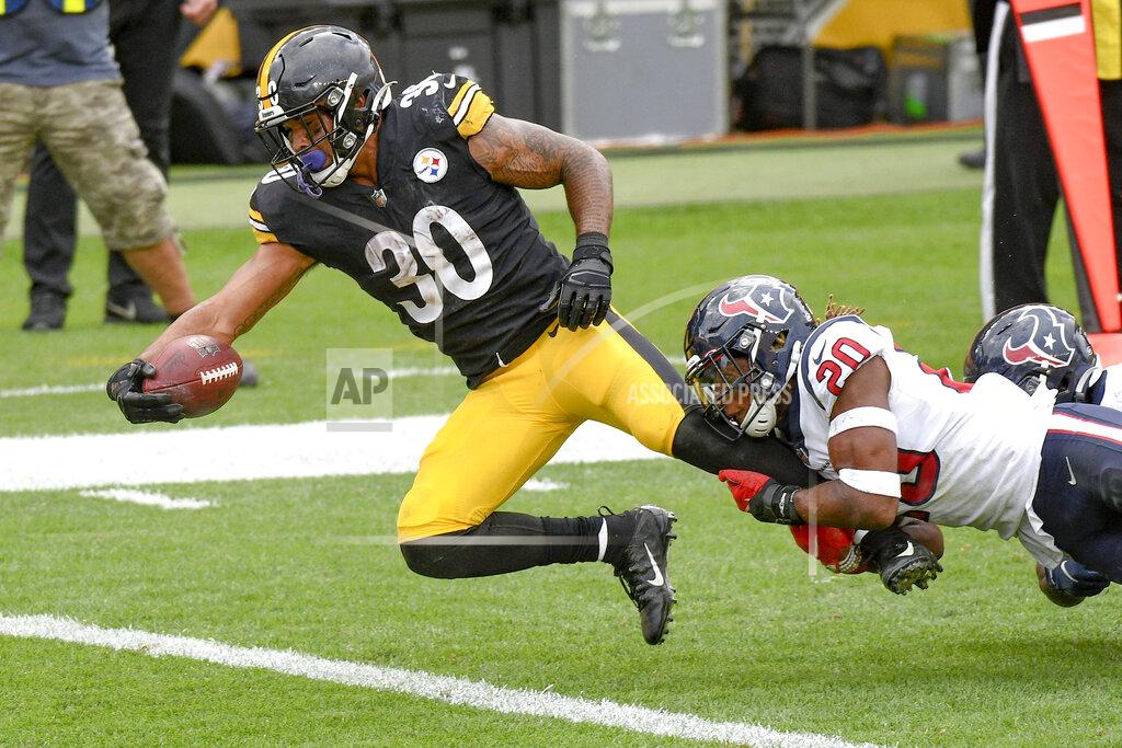 Don Wright Pittsburgh Steelers running back James Conner (30) stretches for the end zone to score as Houston Texans strong safety Justin Reid (20) tries to bring him down in the second half of an NFL football game, Sunday, Sept. 27, 2020, in Pittsburgh. (AP Photo/Don Wright)