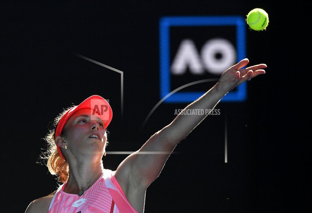 Andy Brownbill Belgium's Elise Mertens serves to Switzerland's Belinda Bencic during their third round match at the Australian Open tennis championship in Melbourne, Australia, Saturday, Feb. 13, 2021.(AP Photo/Andy Brownbill)