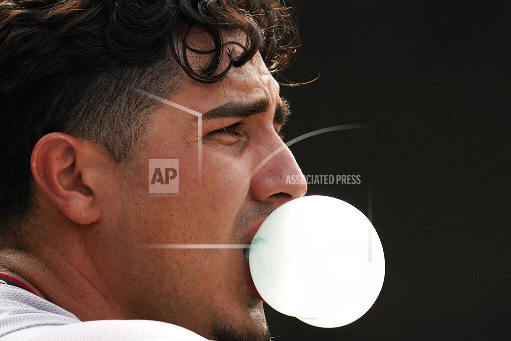 Nam Y. Huh Arizona Diamondbacks' Josh Rojas blows a bubble in the dugout after hitting a solo home run during the seventh inning of a baseball game against the Chicago Cubs in Chicago, Friday, May 20, 2022. (AP Photo/Nam Y. Huh)