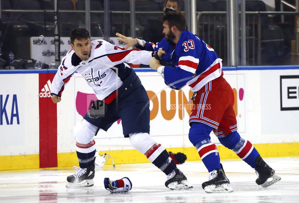 Bruce Bennett Washington Capitals' Garnet Hathaway (21) fights with New York Rangers' Phillip Di Giuseppe (33) during the first period of an NHL hockey game Wednesday, May 5, 2021, in New York. (Bruce Bennett/Pool Photo via AP)