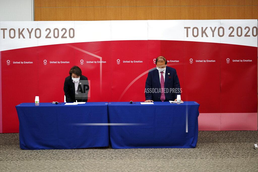 Eugene Hoshiko Seiko Hashimoto, left, President of the Tokyo 2020 Organizing Committee of the Olympic and Paralympic Games (Tokyo 2020), and Toshiro Muto, CEO of Tokyo 2020, bow at the beginning of a news conference Thursday, March 11, 2021, following the International Olympic Committee (IOC) general meeting. (AP Photo/Eugene Hoshiko, Pool)