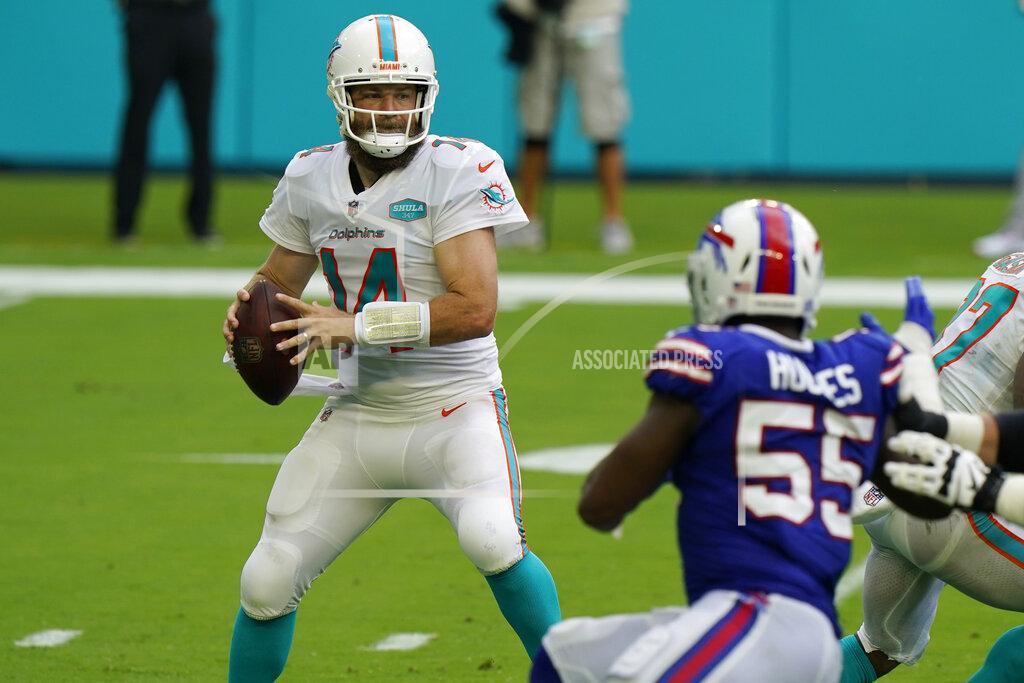 Wilfredo Lee Miami Dolphins quarterback Ryan Fitzpatrick (14) looks to pass, during the first half of an NFL football game against the Buffalo Bills, Sunday, Sept. 20, 2020 in Miami Gardens, Fla. (AP Photo/Wilfredo Lee)