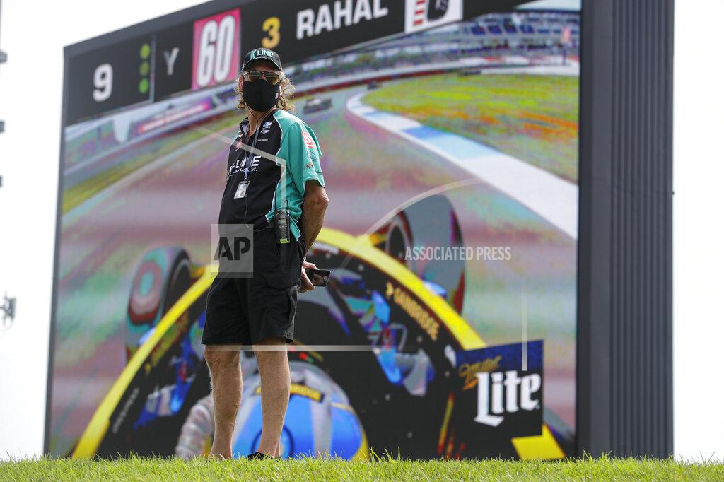 Darron Cummings Mark Kellett, father of race driver Dalton Kellett, of Canada, watches the race in front of a video screen during the IndyCar auto race at Indianapolis Motor Speedway in Indianapolis, Saturday, July 4, 2020. The race was run without fans due to the coronavirus pandemic. (AP Photo/Darron Cummings)