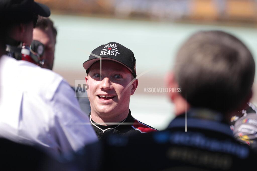 Luis M. Alvarez Tyler Reddick poses is seen in the pits after winning the pole position for the NASCAR Xfinity Series auto racing championship at Homestead-Miami Speedway in Homestead, Fla. Saturday, Nov. 16, 2019. (AP Photo/Luis M. Alvarez)