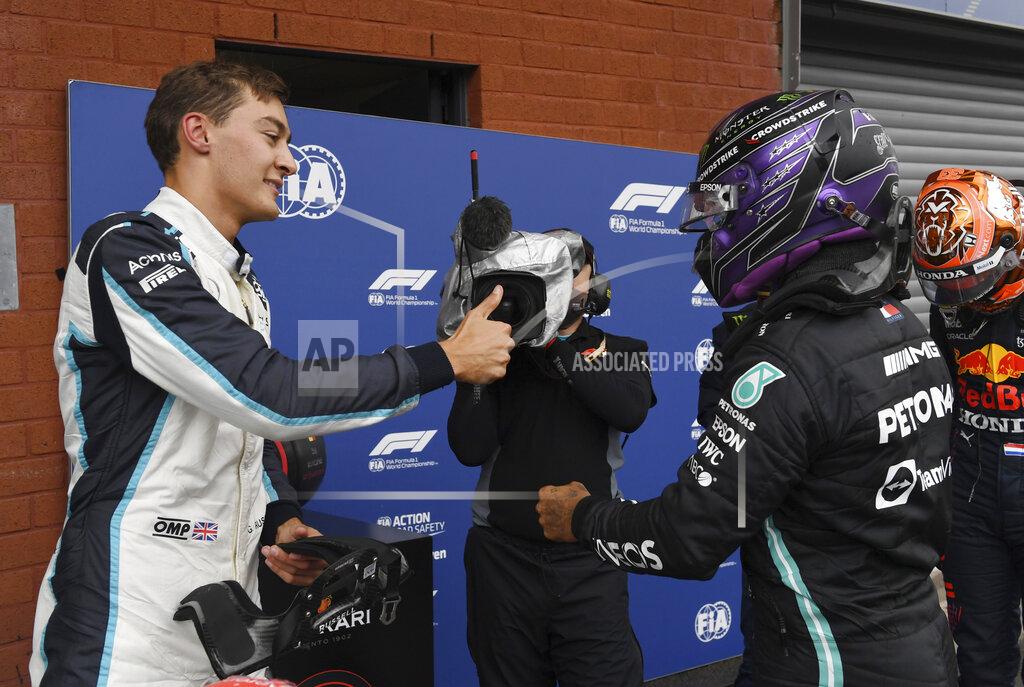 John Thys Second place Williams driver George Russell of Britain, left, gives the thumbs up to third place Mercedes driver Lewis Hamilton of Britain after qualification ahead of the Formula One Grand Prix at the Spa-Francorchamps racetrack in Spa, Belgium, Saturday, Aug. 28, 2021. The Belgian Formula One Grand Prix will take place on Sunday. (John Thys, Pool Photo via AP)