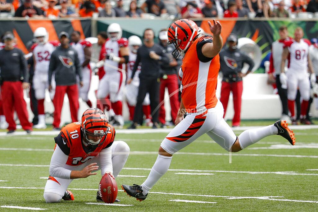Frank Victores Cincinnati Bengals kicker Randy Bullock (4) boots a field goal alongside punter Kevin Huber (10) in the first half of an NFL football game against the Arizona Cardinals, Sunday, Oct. 6, 2019, in Cincinnati. (AP Photo/Frank Victores)