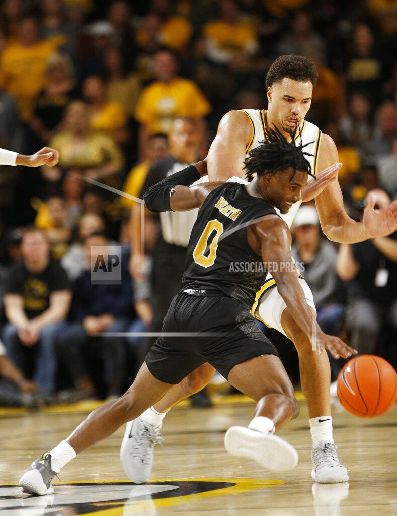 James H. Wallace/Times-Dispatch Alabama State's JJ Heath (0) tries to recover the ball as he is defended by Virginia Commonwealth's Marcus Santos-Silva (14) during an NCAA college basketball game in Richmond, Va., Monday, Nov. 25, 2019. (James H. Wallace/Richmond Times-Dispatch via AP)
