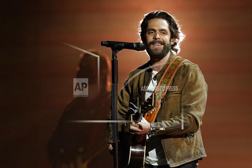 Mark Humphrey Thomas Rhett performs at the 56th annual Academy of Country Music Awards on Saturday, April 17, 2021, at the Grand Ole Opry in Nashville, Tenn. The awards show airs on April 18 with both live and prerecorded segments. (AP Photo/Mark Humphrey)